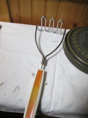 vtg 60s atomic orange gold potato masher heavy duty